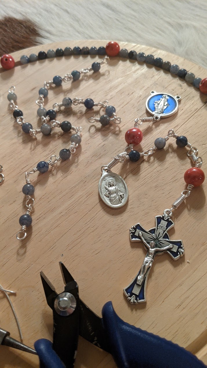 A rosary in progress on the workbench